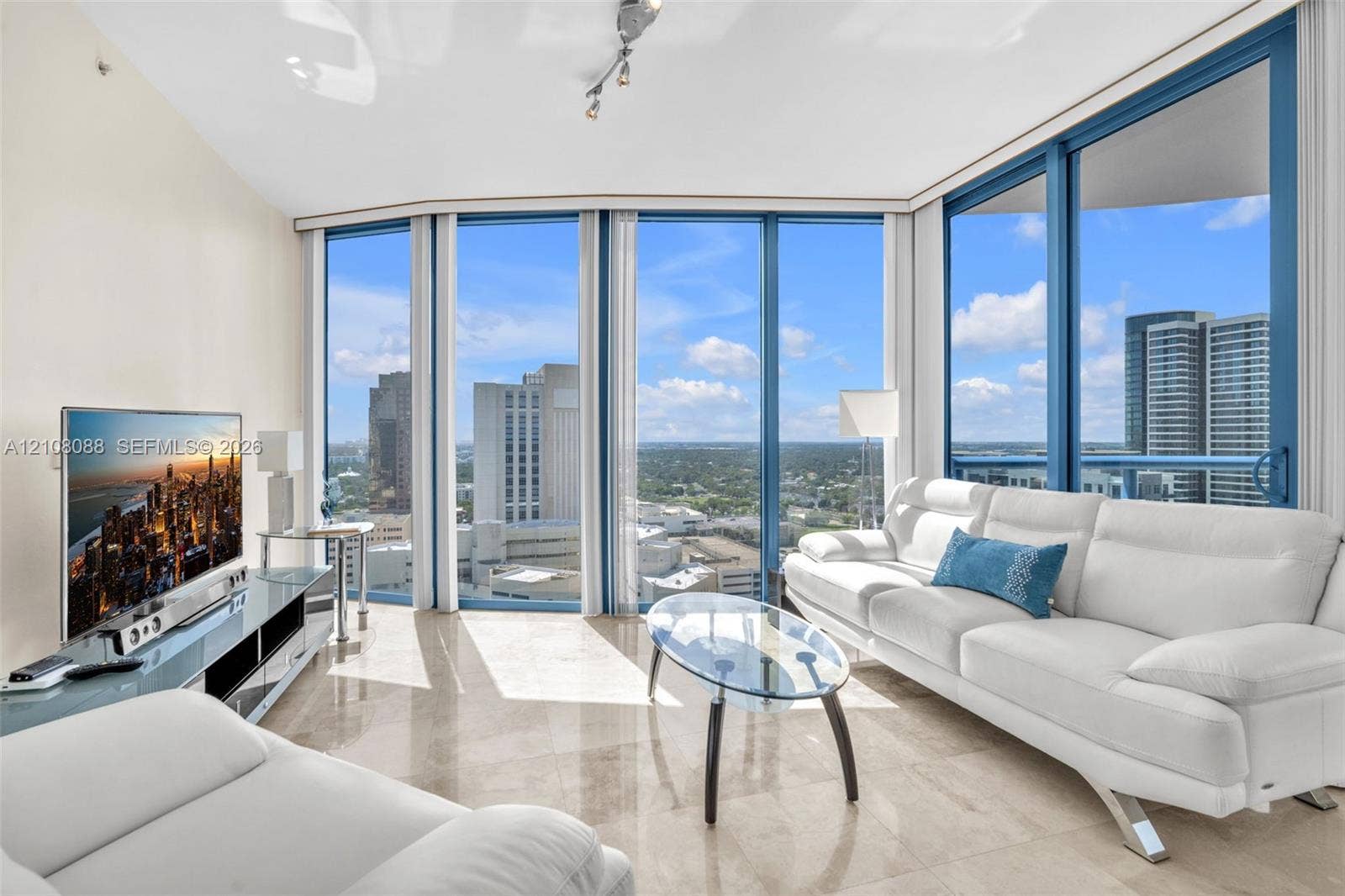333 Las Olas Way, #2601, Fort Lauderdale, FL 33301 Floor-to-ceiling windows, polished stone flooring, and track lighting
