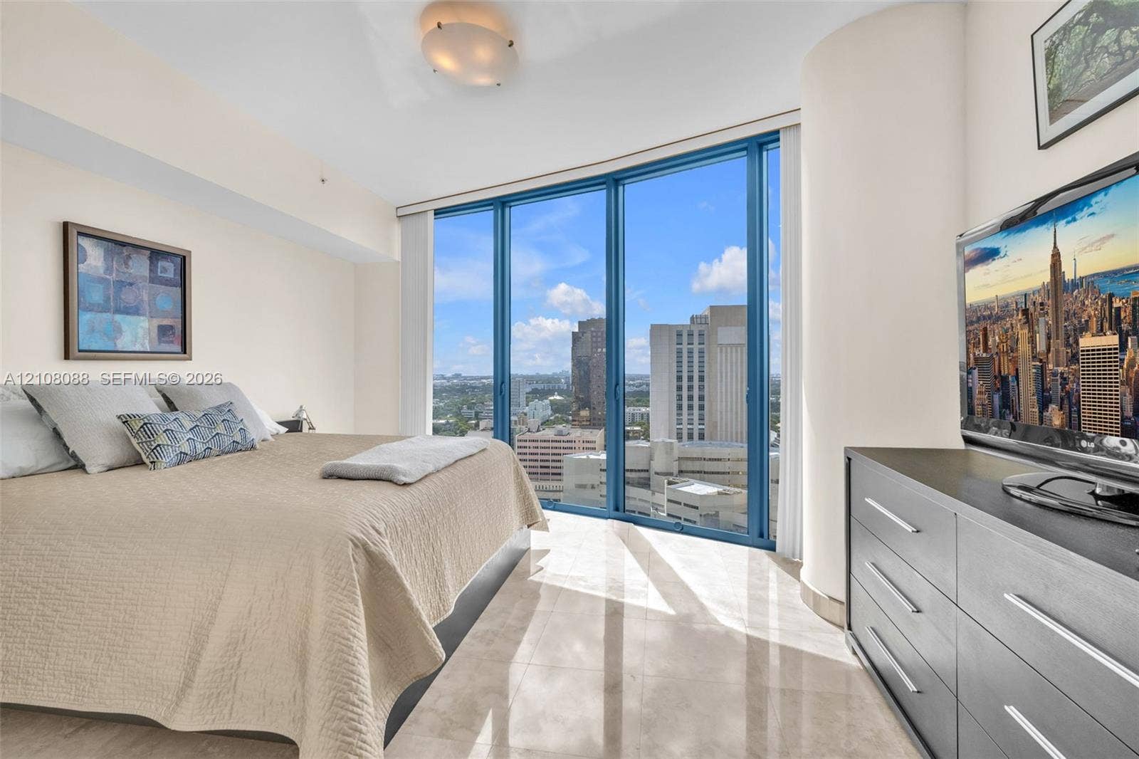 333 Las Olas Way, #2601, Fort Lauderdale, FL 33301 Floor-to-ceiling windows, polished stone flooring, and rounded structural column