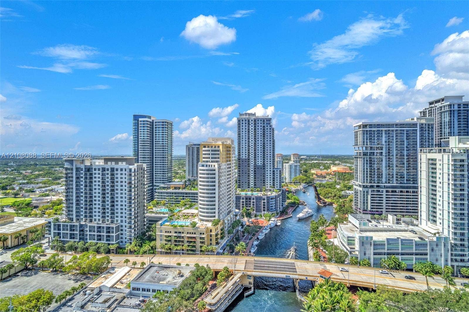 333 Las Olas Way, #2601, Fort Lauderdale, FL 33301 Aerial perspective featuring an urban skyline, high-rise architecture, a waterway, and bridges