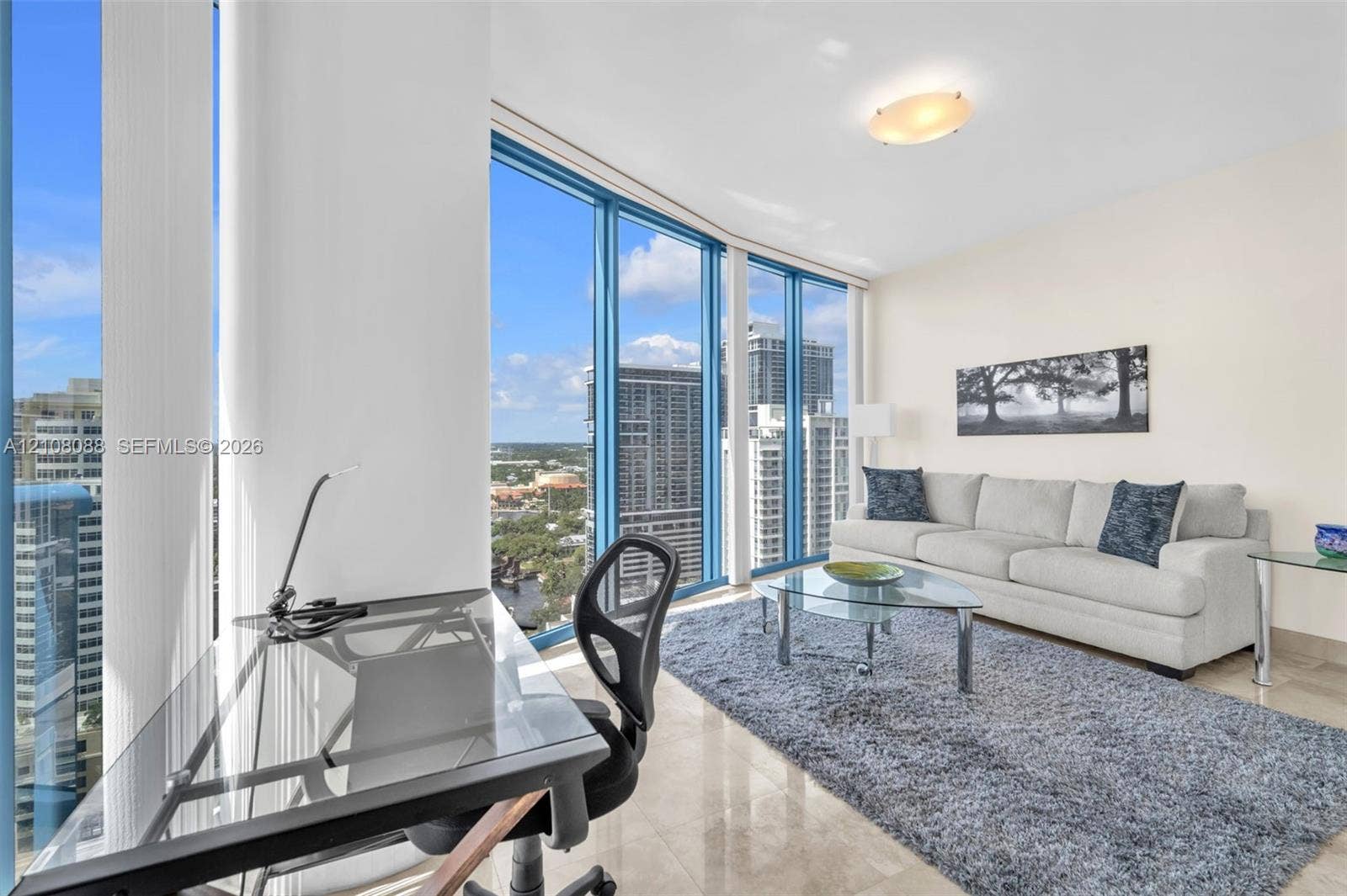333 Las Olas Way, #2601, Fort Lauderdale, FL 33301 Floor-to-ceiling windows, polished stone flooring, and a flush-mount ceiling light fixture
