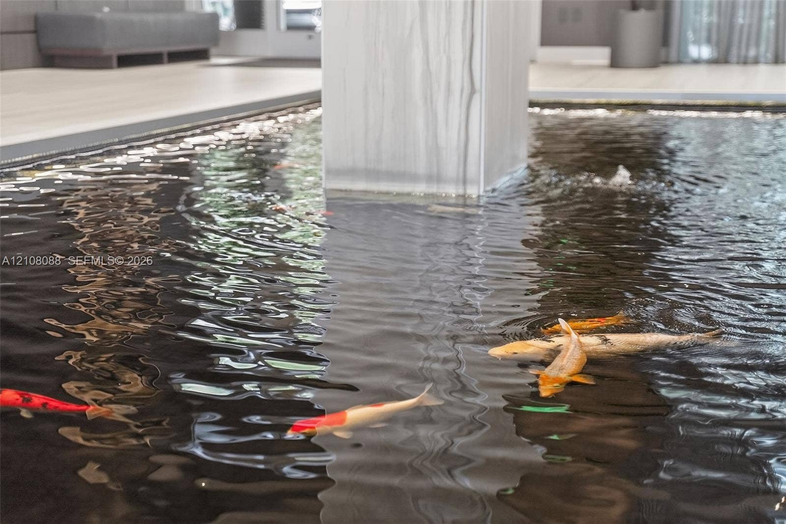 333 Las Olas Way, #2601, Fort Lauderdale, FL 33301 Indoor water feature with koi, stone-finish column, and light-toned flooring