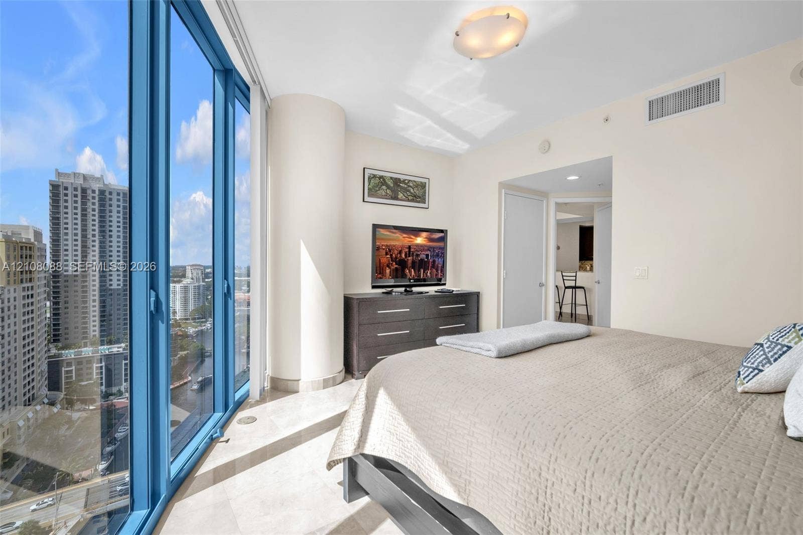333 Las Olas Way, #2601, Fort Lauderdale, FL 33301 Floor-to-ceiling windows, polished stone flooring, and structural rounded column