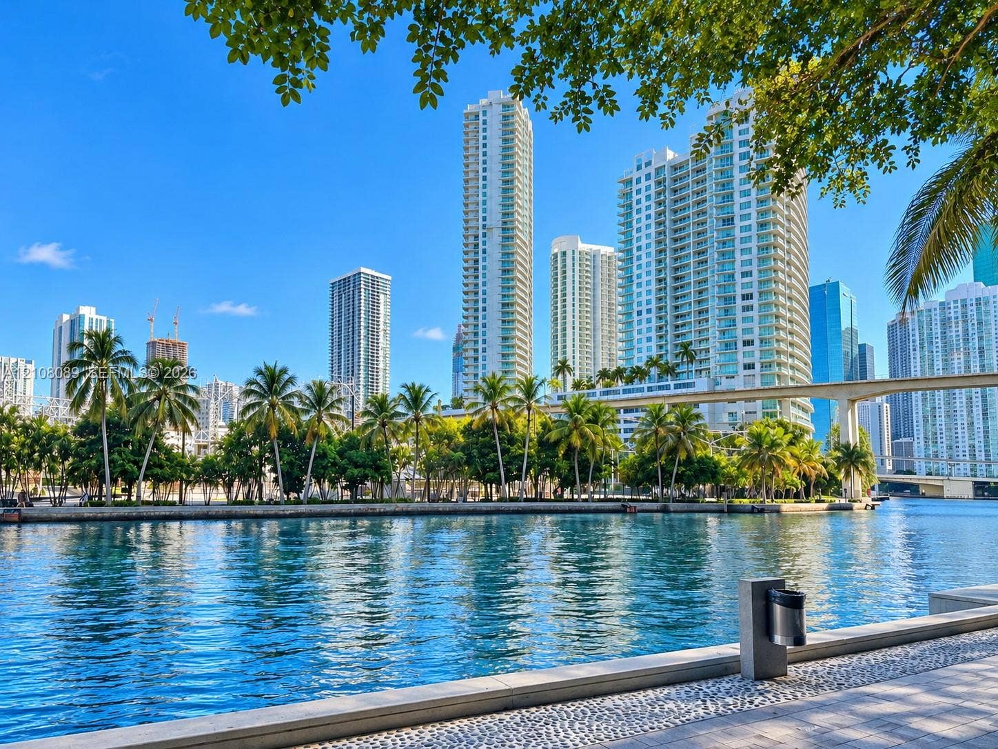 185 SW 7th Street, #3608, Miami, FL 33130 Waterfront concrete promenade featuring pebble-stone paving and mature palm trees