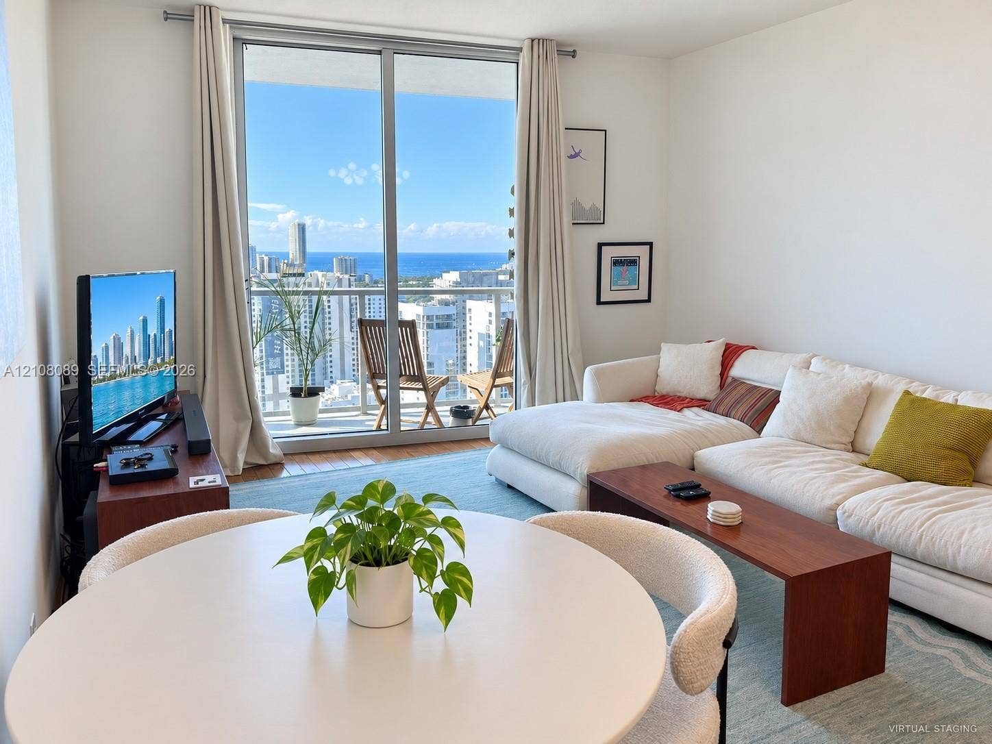 185 SW 7th Street, #3608, Miami, FL 33130 Full-height sliding glass doors with access to a private balcony, wood-finish flooring, and expansive natural light
