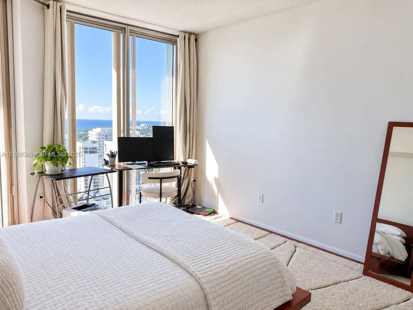 185 SW 7th Street, #3608, Miami, FL 33130 Floor-to-ceiling windows featuring expansive coastal and urban scenery
