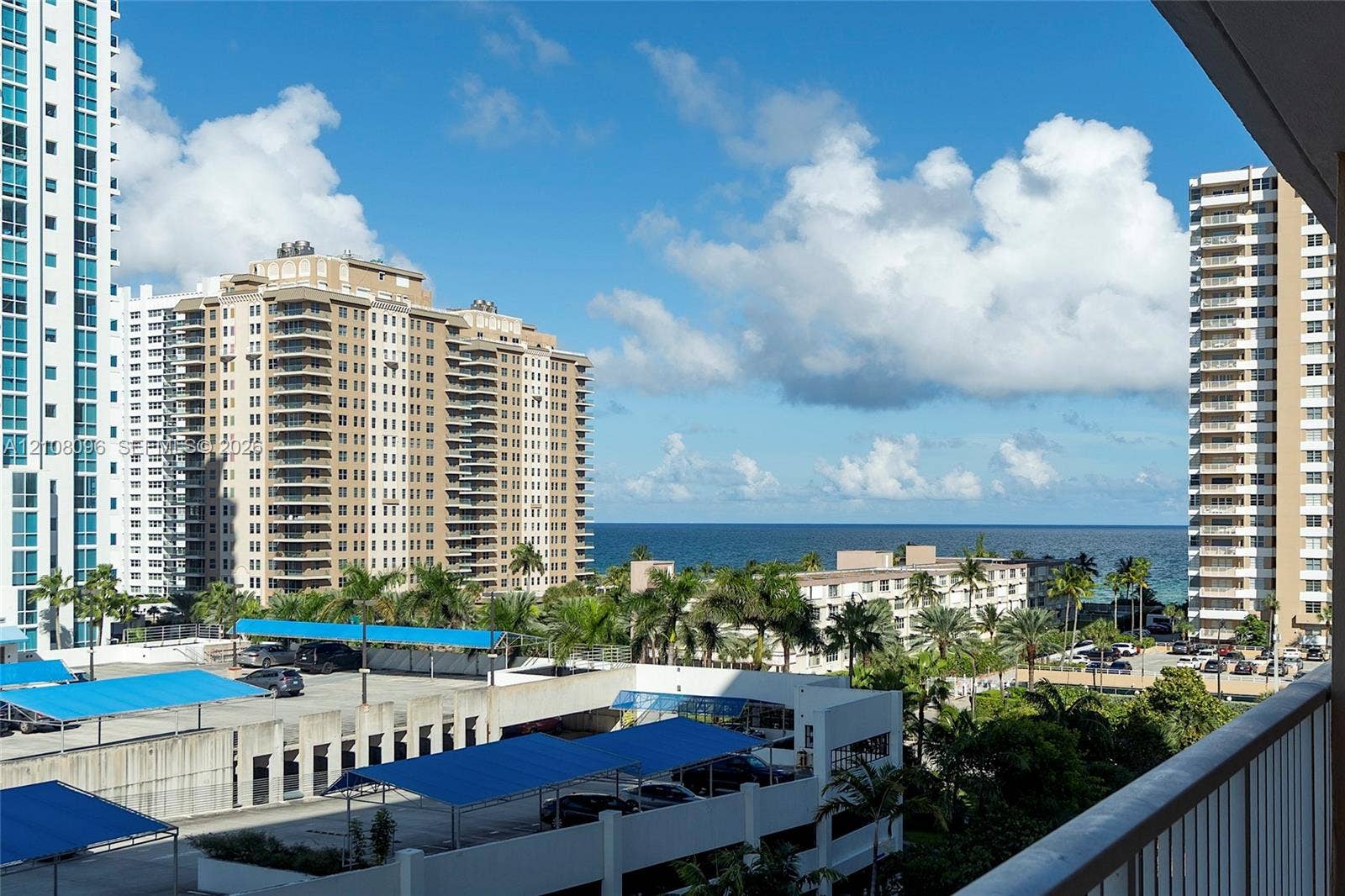 1965 S Ocean Drive, #6H, Hallandale Beach, Hallandale Beach, FL 33009 Balcony overlooking the coastline with palm trees and ocean horizon