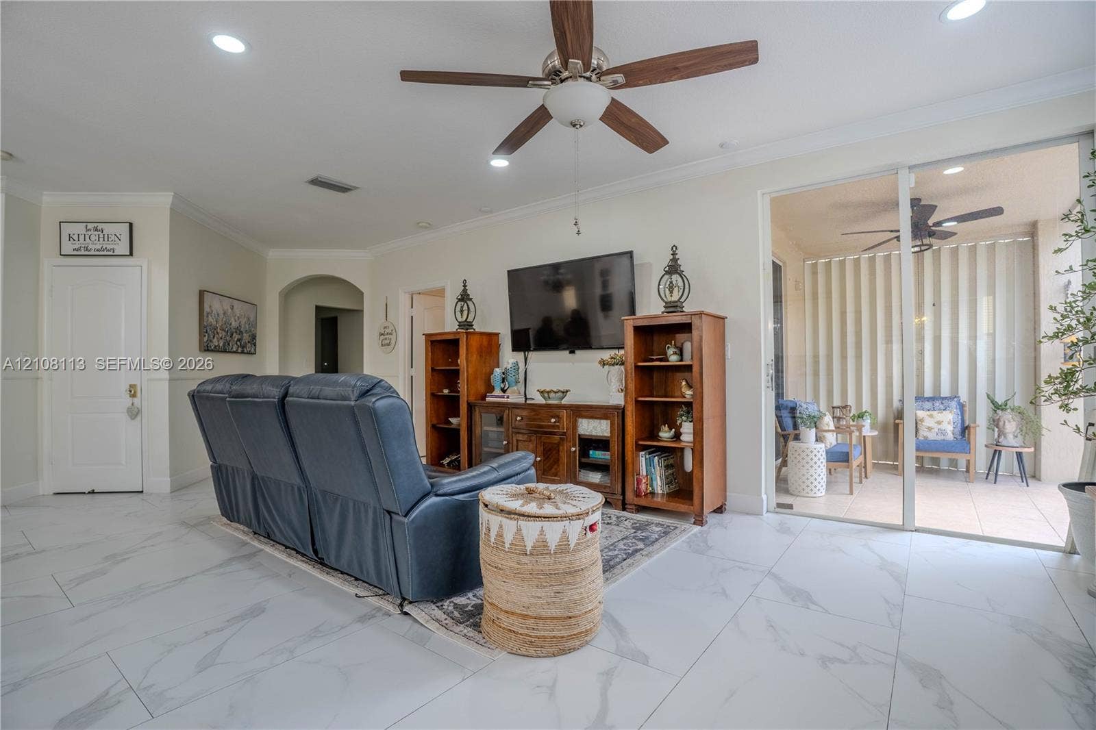 2294 SW 126th Avenue, Miramar, FL 33027 Large-format tile flooring, recessed ceiling lighting, central ceiling fan, and sliding glass doors providing external access