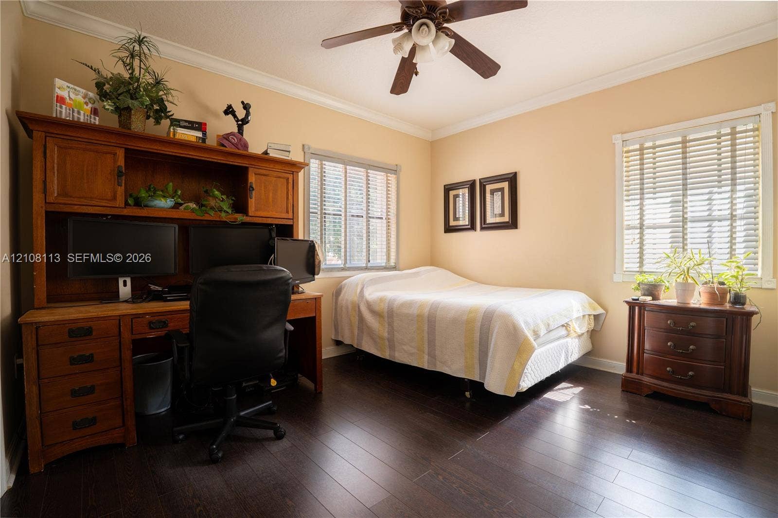 2294 SW 126th Avenue, Miramar, FL 33027 Dark wood-finish flooring, crown molding, and a central ceiling fan