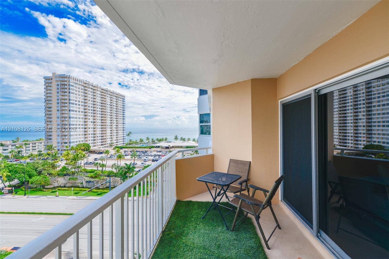 1985 S Ocean Drive, #8M, Hallandale Beach, FL 33009 Private balcony featuring a metal railing, solid surface flooring, and sliding glass door access