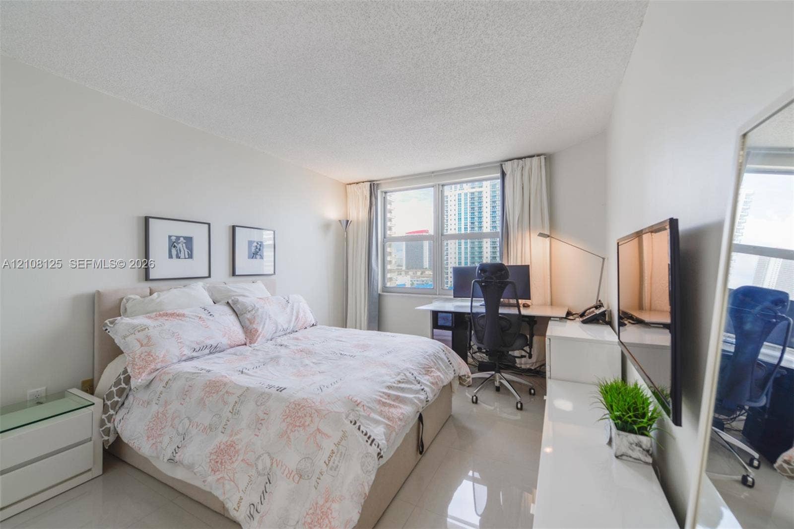 1985 S Ocean Drive, #8M, Hallandale Beach, FL 33009 Bright room featuring large windows, high-gloss tile flooring, and neutral wall tones