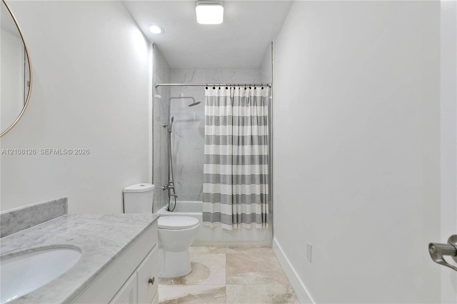 11700 NW 4th Street, Plantation, Plantation, FL 33325 Bathroom featuring a vanity with a stone-top counter, undermount sink, shower-tub combination with stone-style surround, and tile flooring