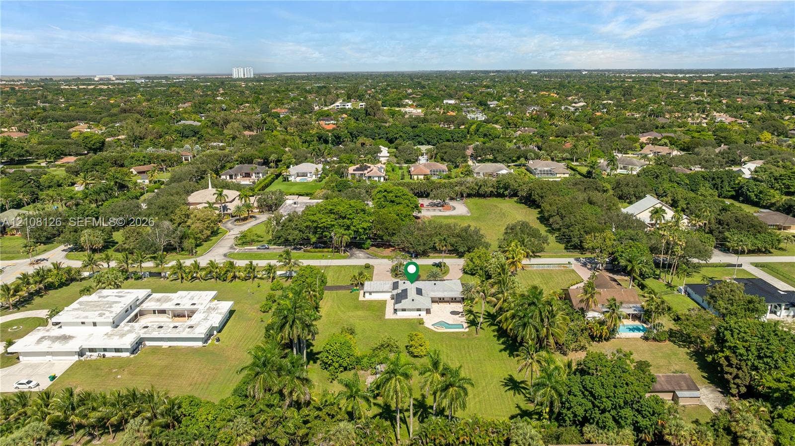 11700 NW 4th Street, Plantation, Plantation, FL 33325 Aerial perspective featuring an expansive lot, established tropical landscaping, mature canopy trees, and an integrated swimming pool