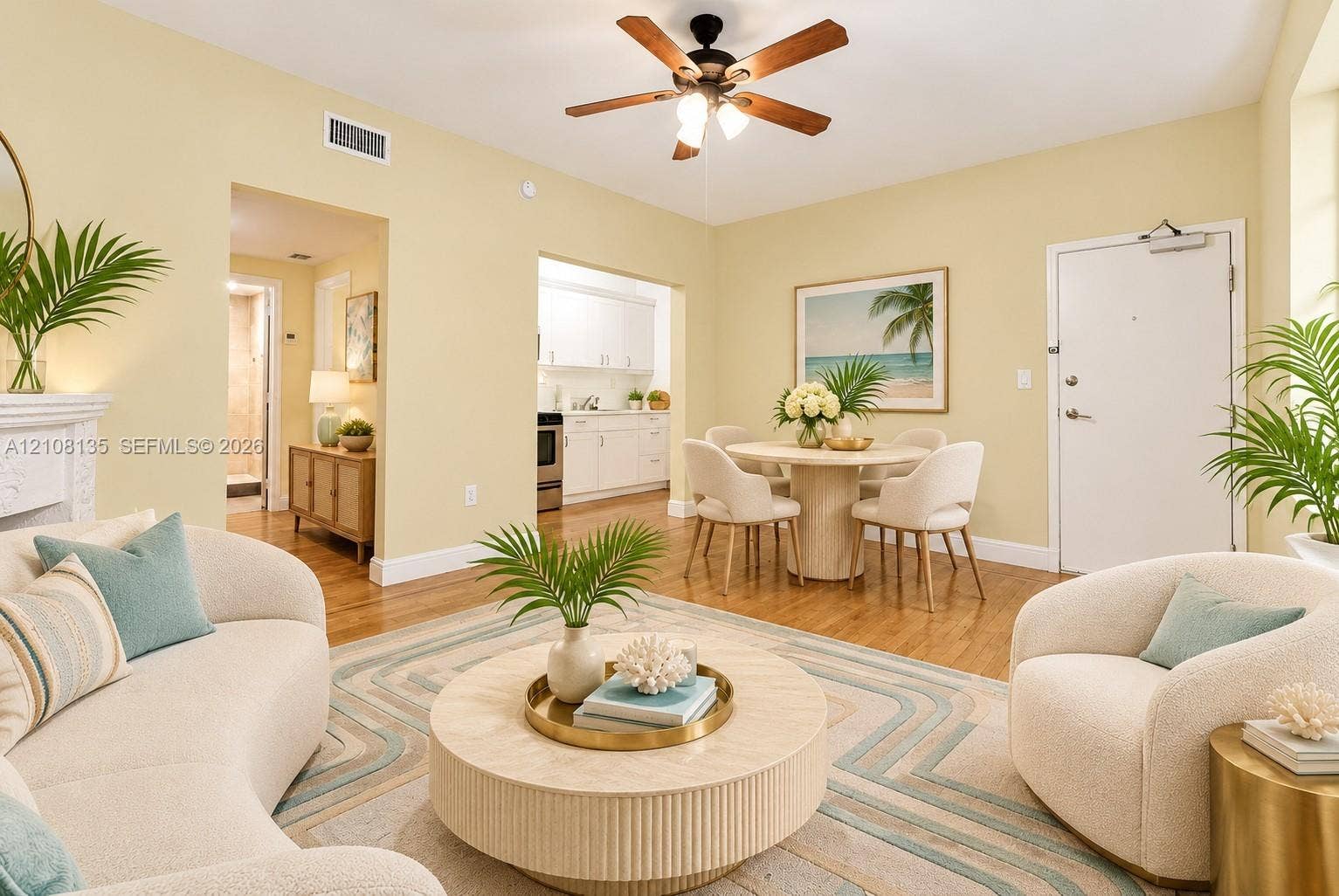 Living area featuring wood-finish flooring, decor fireplace, and a multi-blade ceiling fan. ai furniture