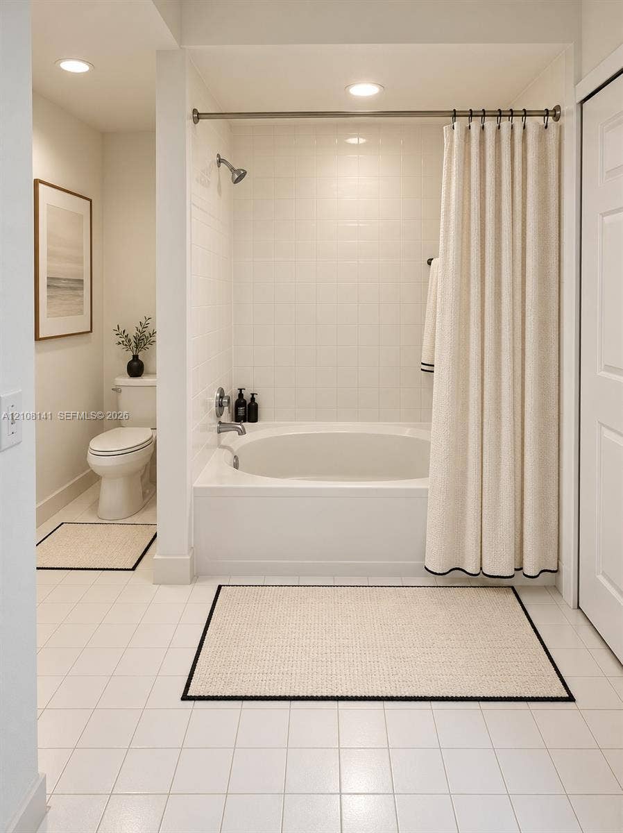3135 NE 184th Street, #2205, Aventura, FL 33160 Bathroom featuring a built-in soaking tub with a tiled surround, recessed lighting, and white tile flooring