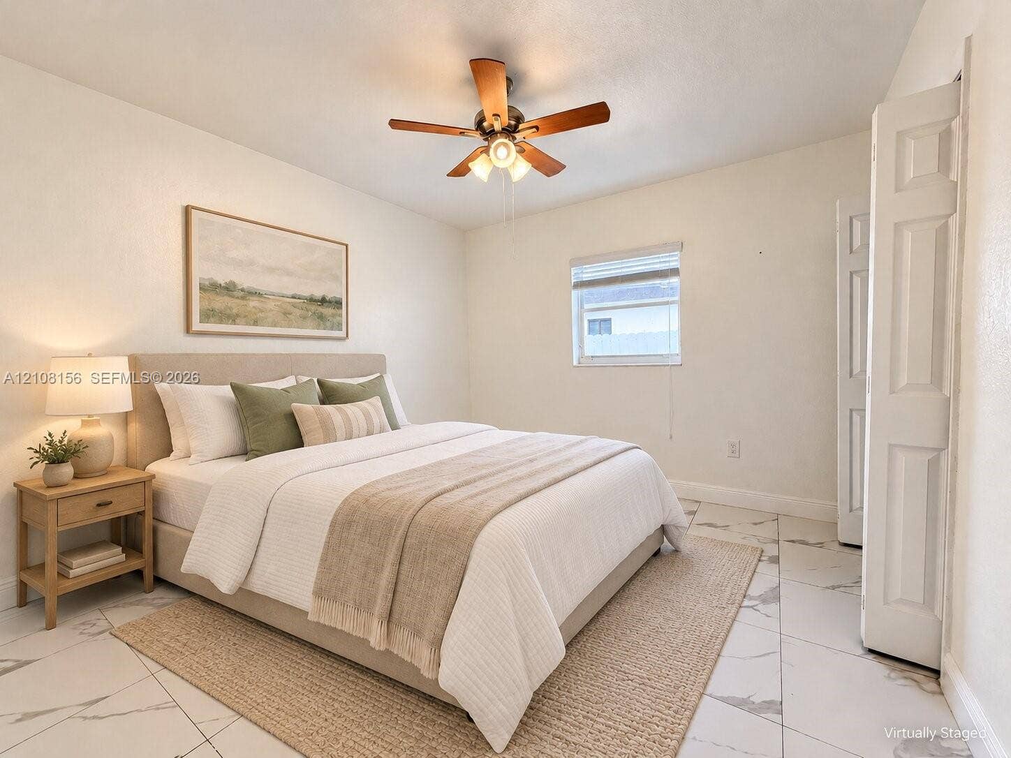 17175 NW 41st Avenue, Miami Gardens, FL 33055 Neutral-toned interior featuring large-format tile flooring, a multi-blade ceiling fan with integrated lighting, and a bifold closet door