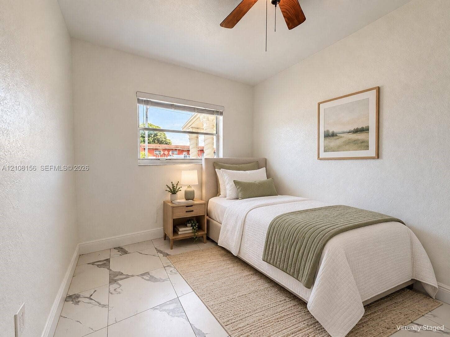 17175 NW 41st Avenue, Miami Gardens, FL 33055 Neutral-toned room featuring large-format tile flooring with gray veining, a single-hung window, and a ceiling fan with integrated lighting