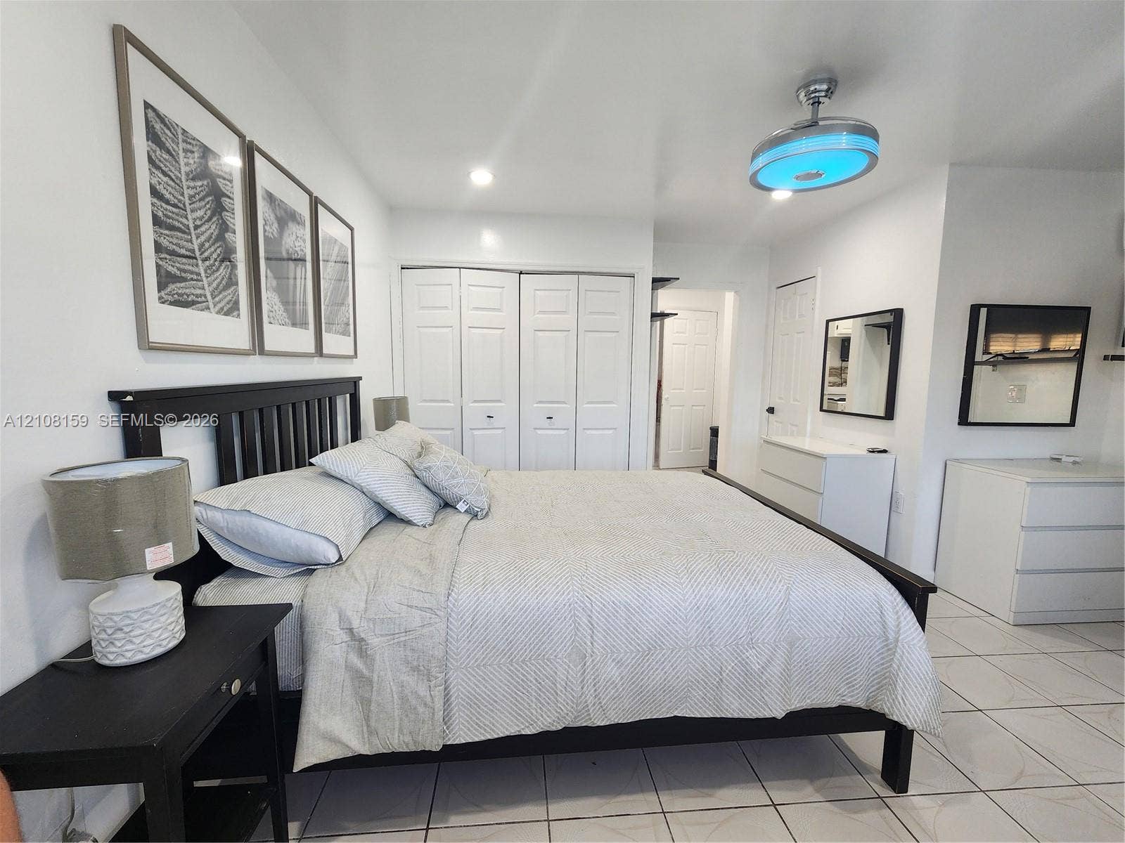 Tile flooring, bi-fold closet doors, and recessed ceiling lighting
