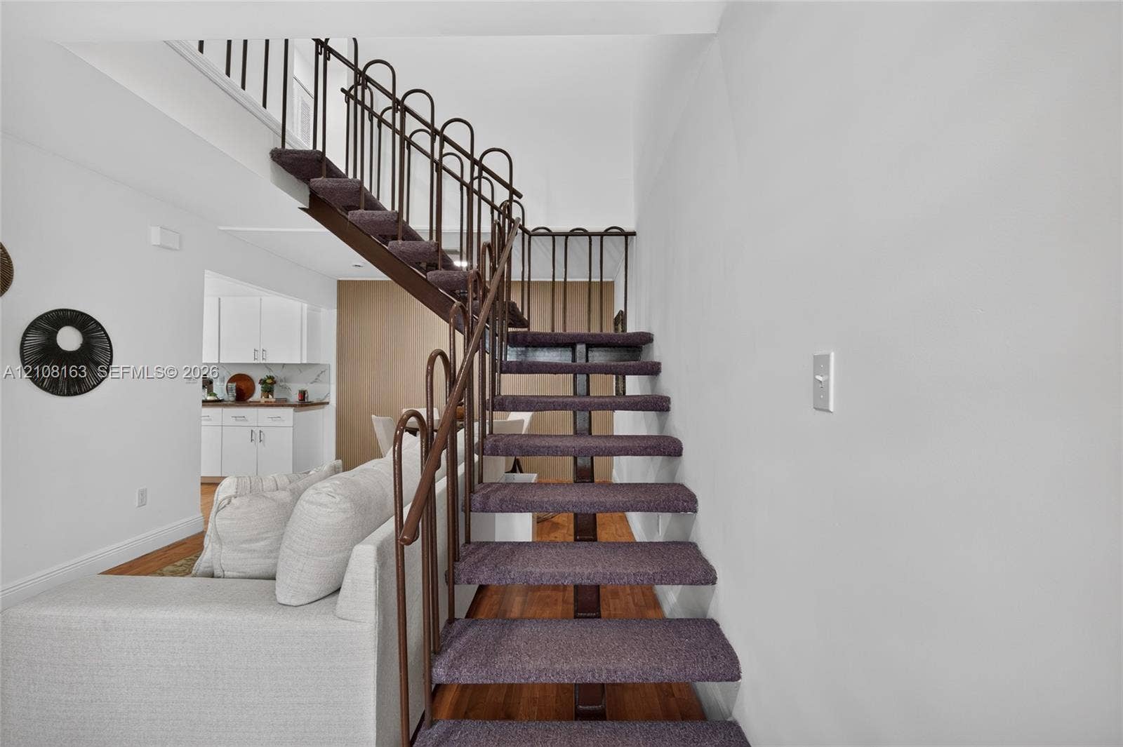 11510 SW 5th Street, #1, Sweetwater, Sweetwater, FL 33174 Open-riser staircase featuring metal railings and carpeted treads