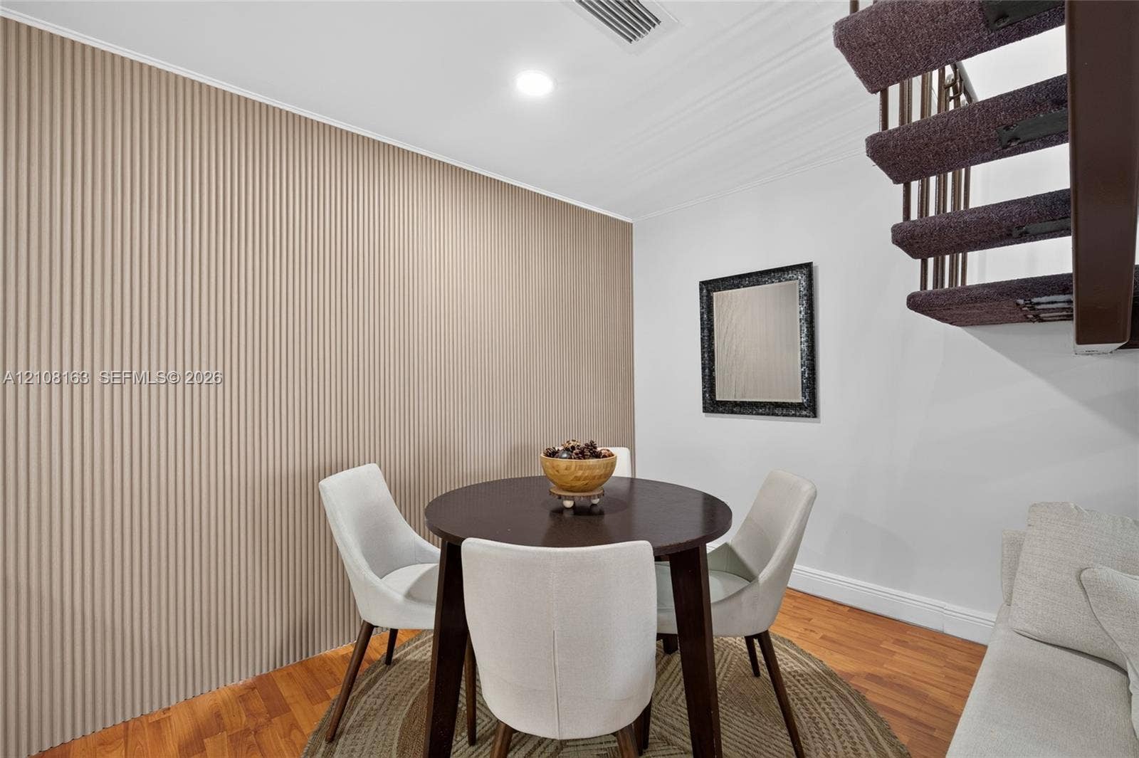 11510 SW 5th Street, #1, Sweetwater, Sweetwater, FL 33174 Textured accent wall, wood-finish flooring, and floating staircase with open risers
