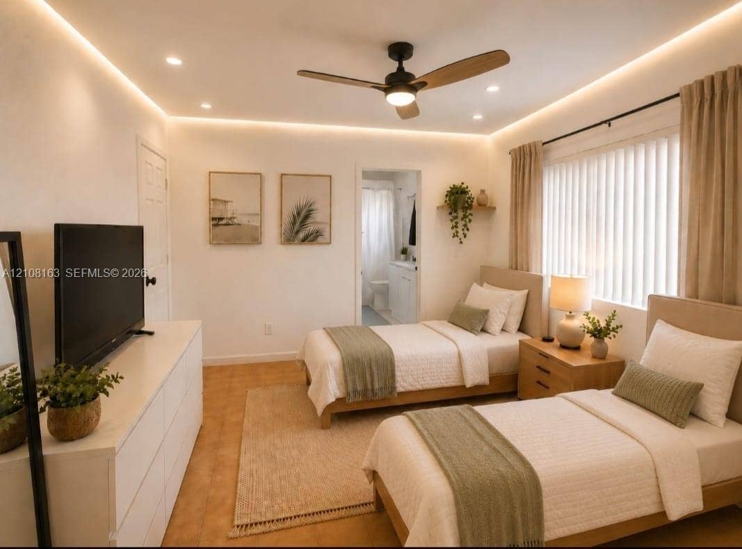 11510 SW 5th Street, #1, Sweetwater, Sweetwater, FL 33174 Interior space featuring recessed ceiling lighting, perimeter cove lighting, a three-blade ceiling fan, and large-format tile flooring