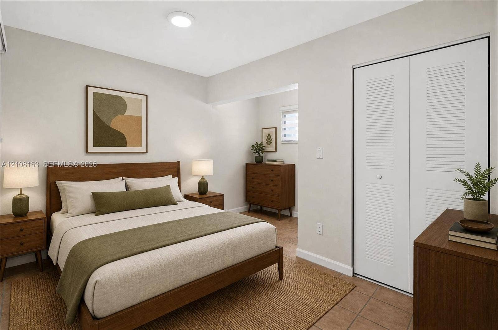 11510 SW 5th Street, #1, Sweetwater, Sweetwater, FL 33174 Neutral-toned walls, tile flooring, and closet featuring white dual-panel louvered doors