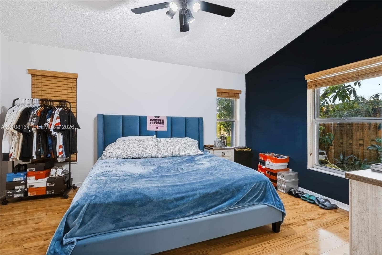 3983 NW 122nd Terrace, Sunrise, FL 33323 Vaulted ceilings, wood-finish flooring, and natural light via multiple windows with installed wood blinds