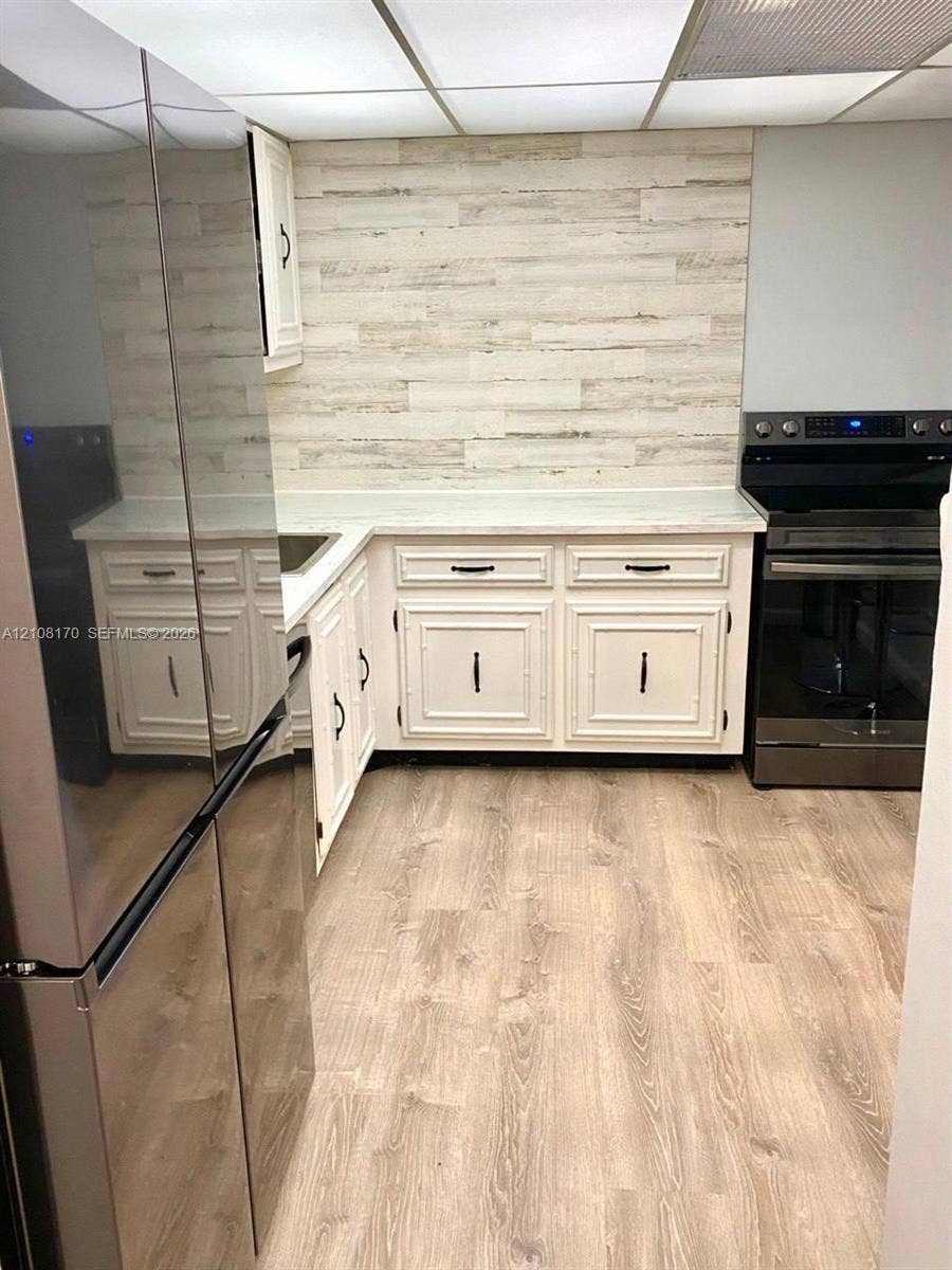 801 Three Islands Boulevard, #108, Hallandale Beach, FL 33009 Updated Kitchen Flooring and Backdrop