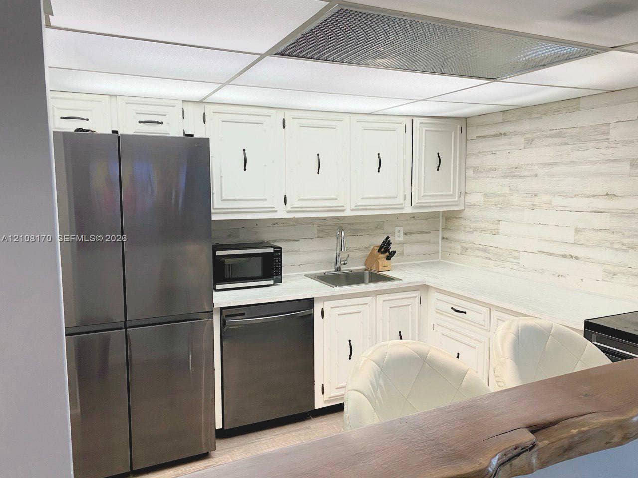 801 Three Islands Boulevard, #108, Hallandale Beach, FL 33009 Kitchen View From the Bar