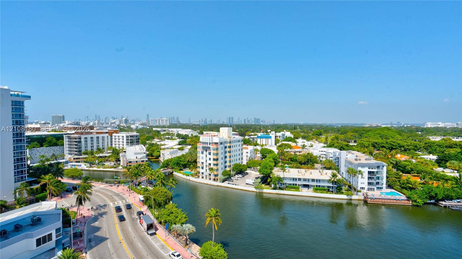 2457 Collins Avenue, #1501, Miami Beach, FL 33140 High-altitude perspective featuring coastal waterway, cityscape skyline, surrounding lush canopy, and street-level thoroughfare