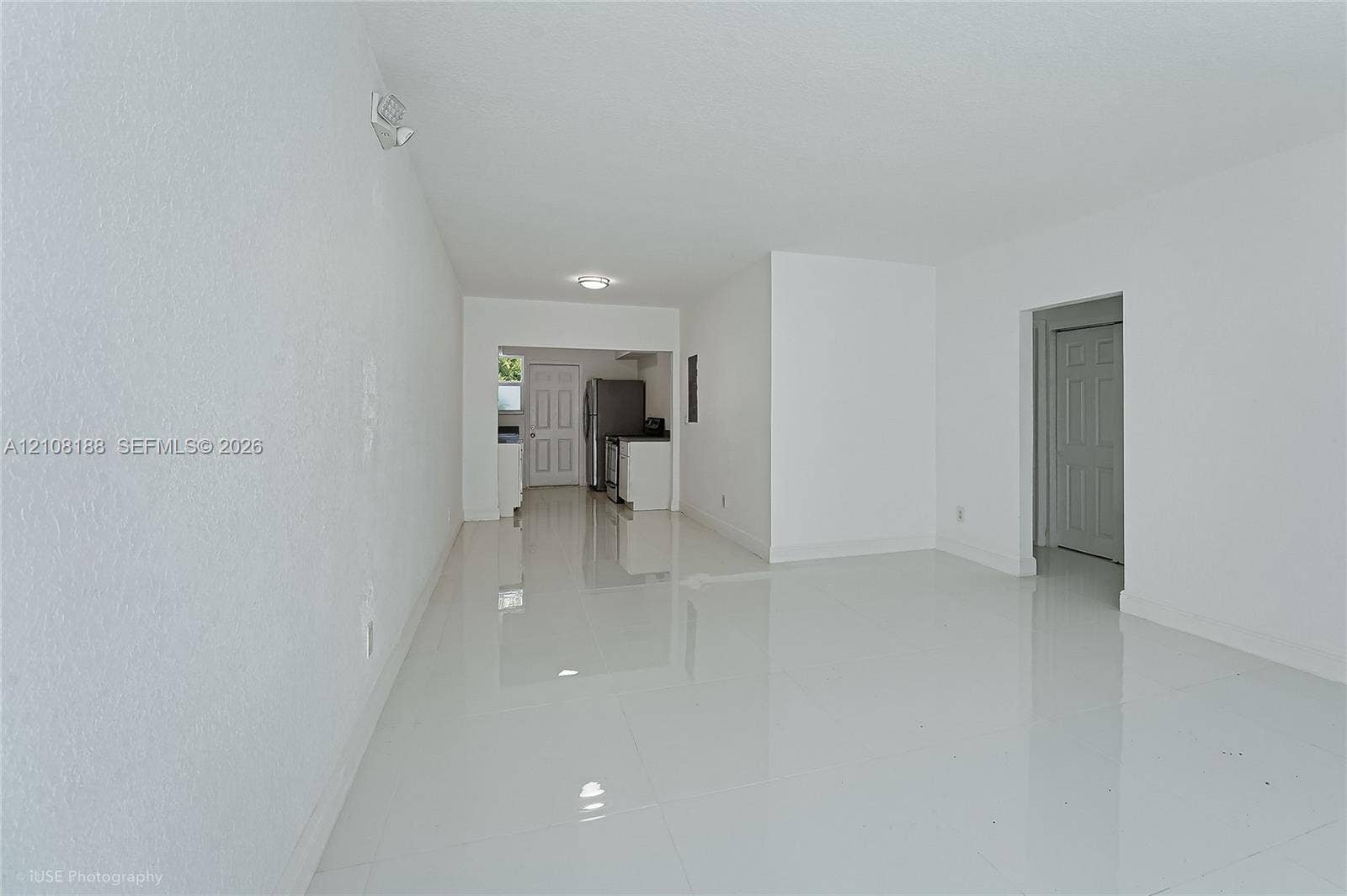 9790 E Bay Harbor Drive, #3N, Bay Harbor Islands, Bay Harbor Islands, FL 33154 Open interior featuring polished tile flooring, smooth-finish walls, recessed ceiling lighting, and six-panel interior doors