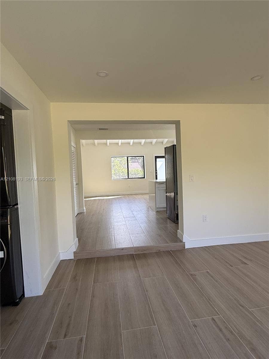 1929 SW 21st Street, #0, Miami, Miami, FL 33145 Interior space featuring wood-finish tile flooring, recessed lighting, and a multi-level floor plan with an exposed beam ceiling