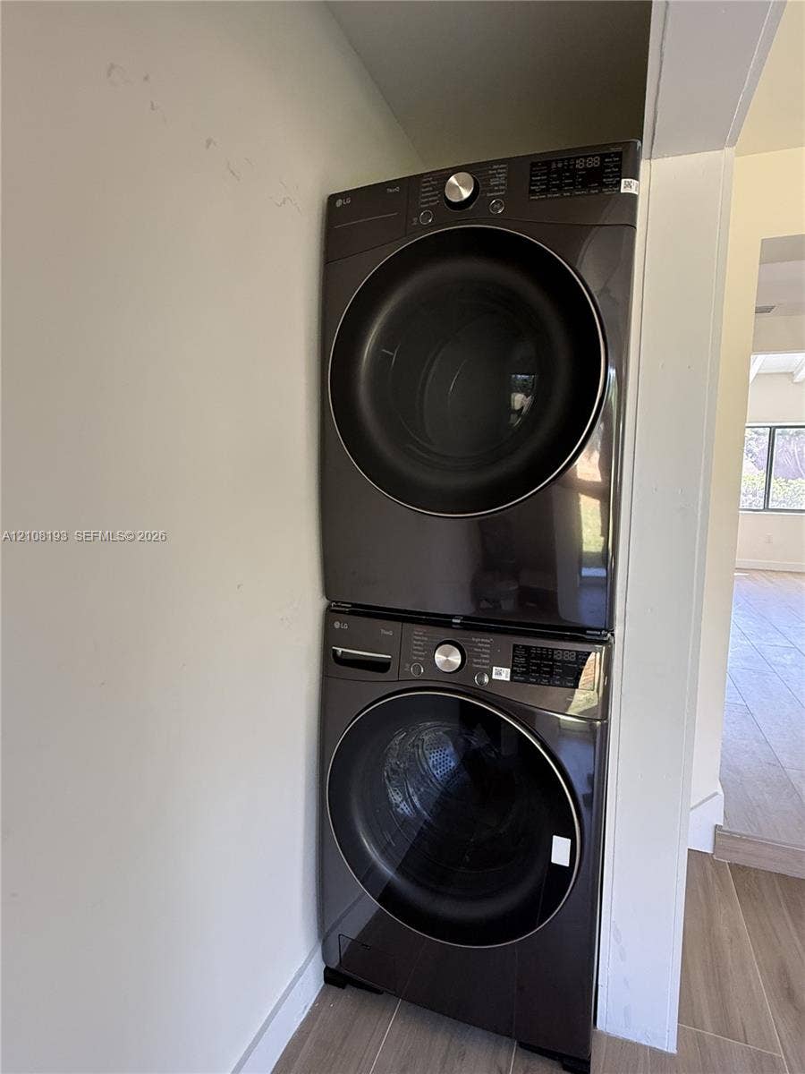 1929 SW 21st Street, #0, Miami, Miami, FL 33145 Stacked metallic-finish front-load laundry unit featuring integrated digital control panels