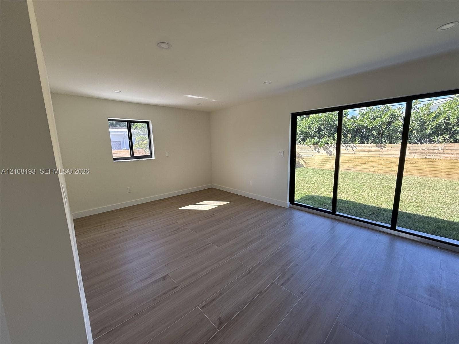 1929 SW 21st Street, #0, Miami, Miami, FL 33145 Interior featuring wood-finish flooring, recessed lighting, and expansive glass sliding doors