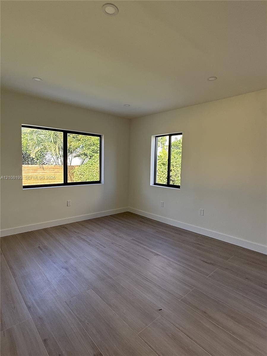 1929 SW 21st Street, #0, Miami, Miami, FL 33145 Interior space featuring wood-finish flooring, recessed lighting, and windows with black frames