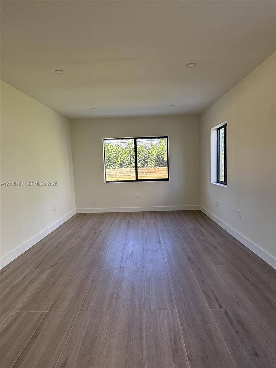 1929 SW 21st Street, #0, Miami, Miami, FL 33145 Neutral interior featuring wood-finish flooring, recessed lighting, and windows with black frames