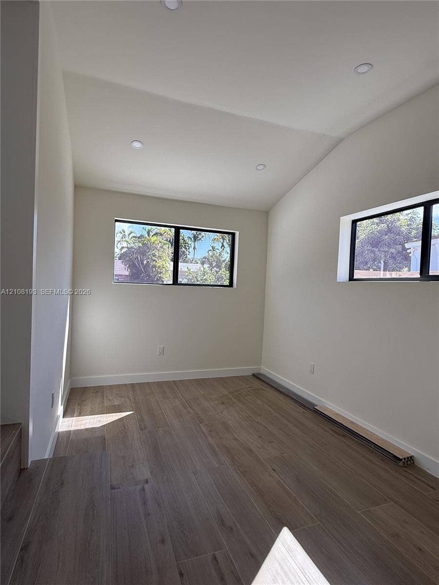 1929 SW 21st Street, #0, Miami, Miami, FL 33145 Vaulted ceiling with recessed lighting, wood-finish flooring, and black-framed windows