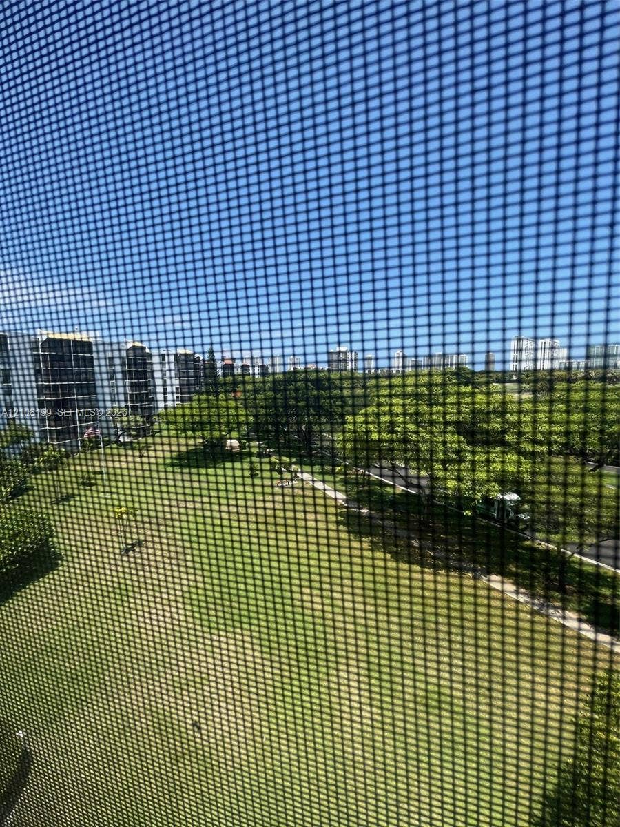 20400 W Country Club Drive, #608, Aventura, Aventura, FL 33180 Expansive green space featuring mature trees and paved pathways