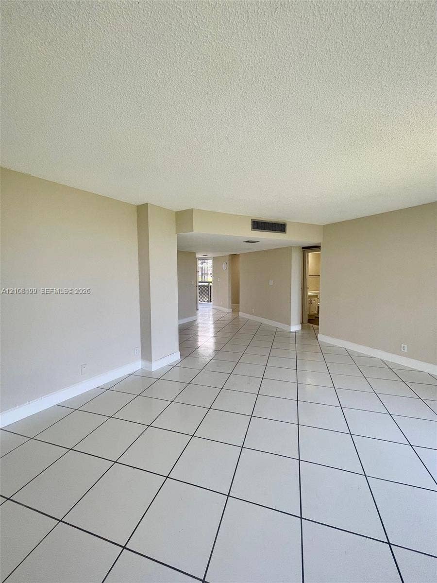 20400 W Country Club Drive, #608, Aventura, Aventura, FL 33180 Interior space featuring large-format diagonal tile flooring and neutral wall tones