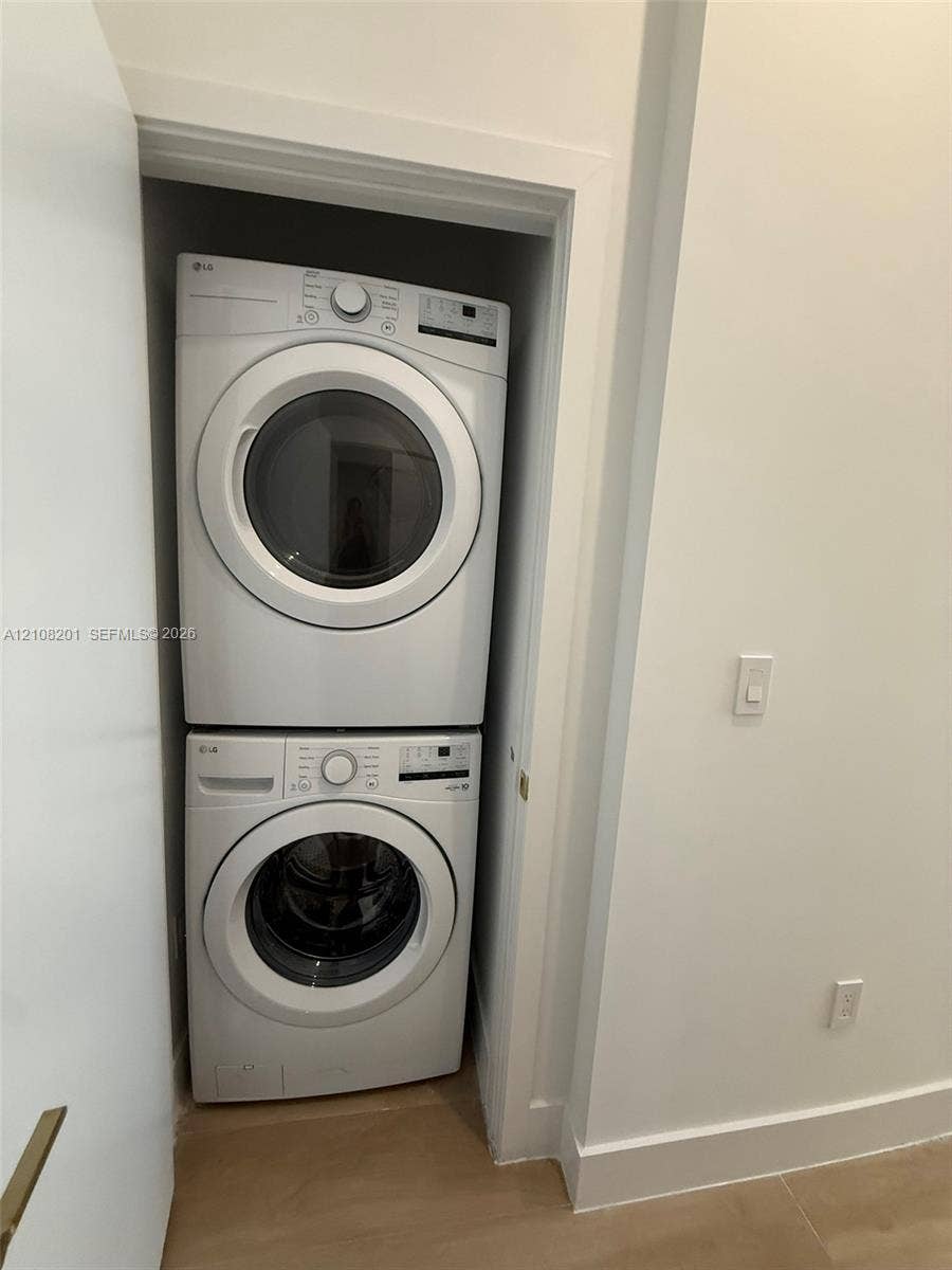 32 90 Ne 32 Street, #1115, Miami, Miami, FL 33127 Stacked white front-load washer and dryer set