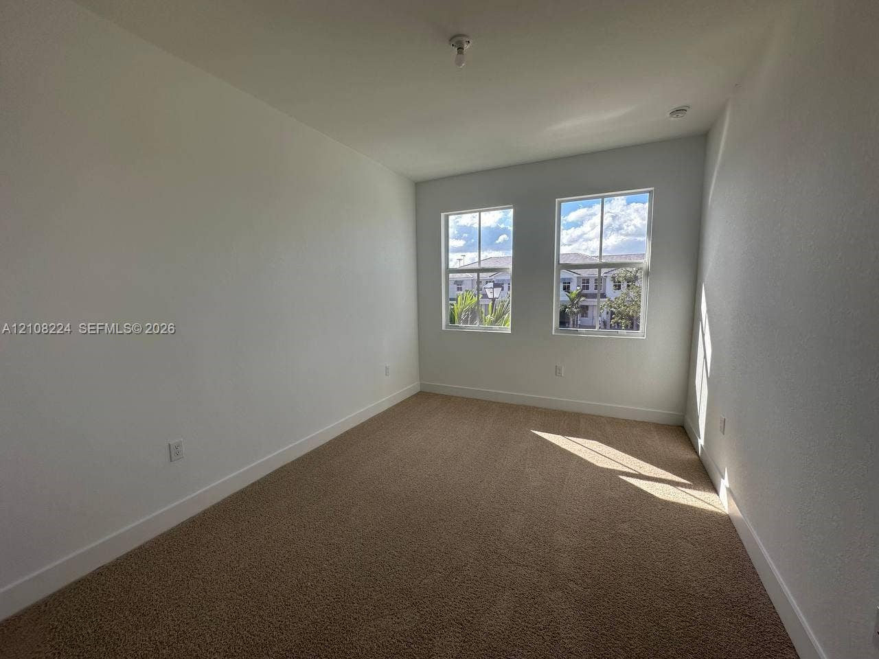 17183 SW 2nd Circle, #17183, Pembroke Pines, Pembroke Pines, FL 33027 Neutral-toned carpeting, dual-pane windows with muntins, and textured walls
