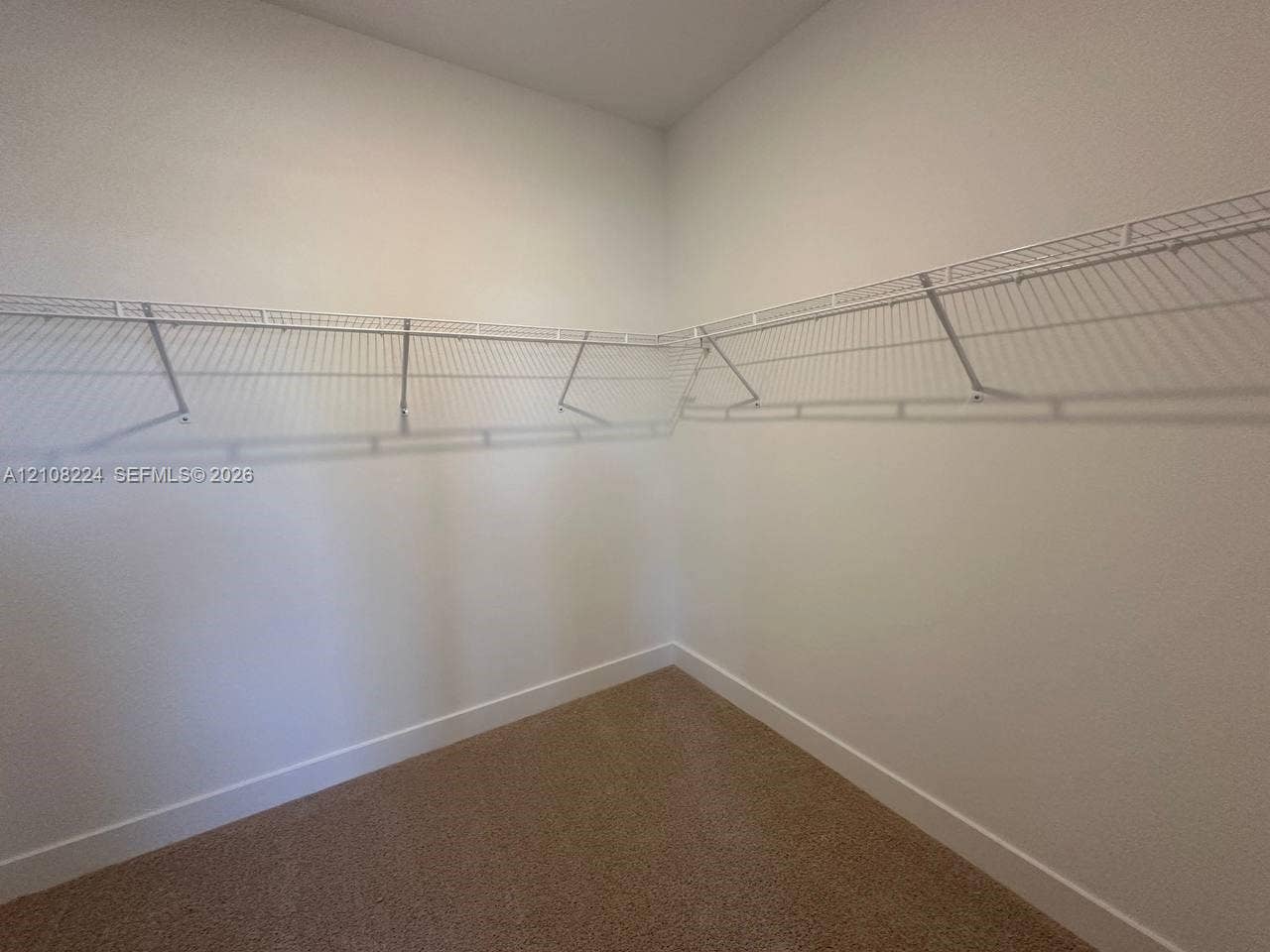 17183 SW 2nd Circle, #17183, Pembroke Pines, Pembroke Pines, FL 33027 Walk-in storage space featuring neutral carpeting and wrap-around wire shelving