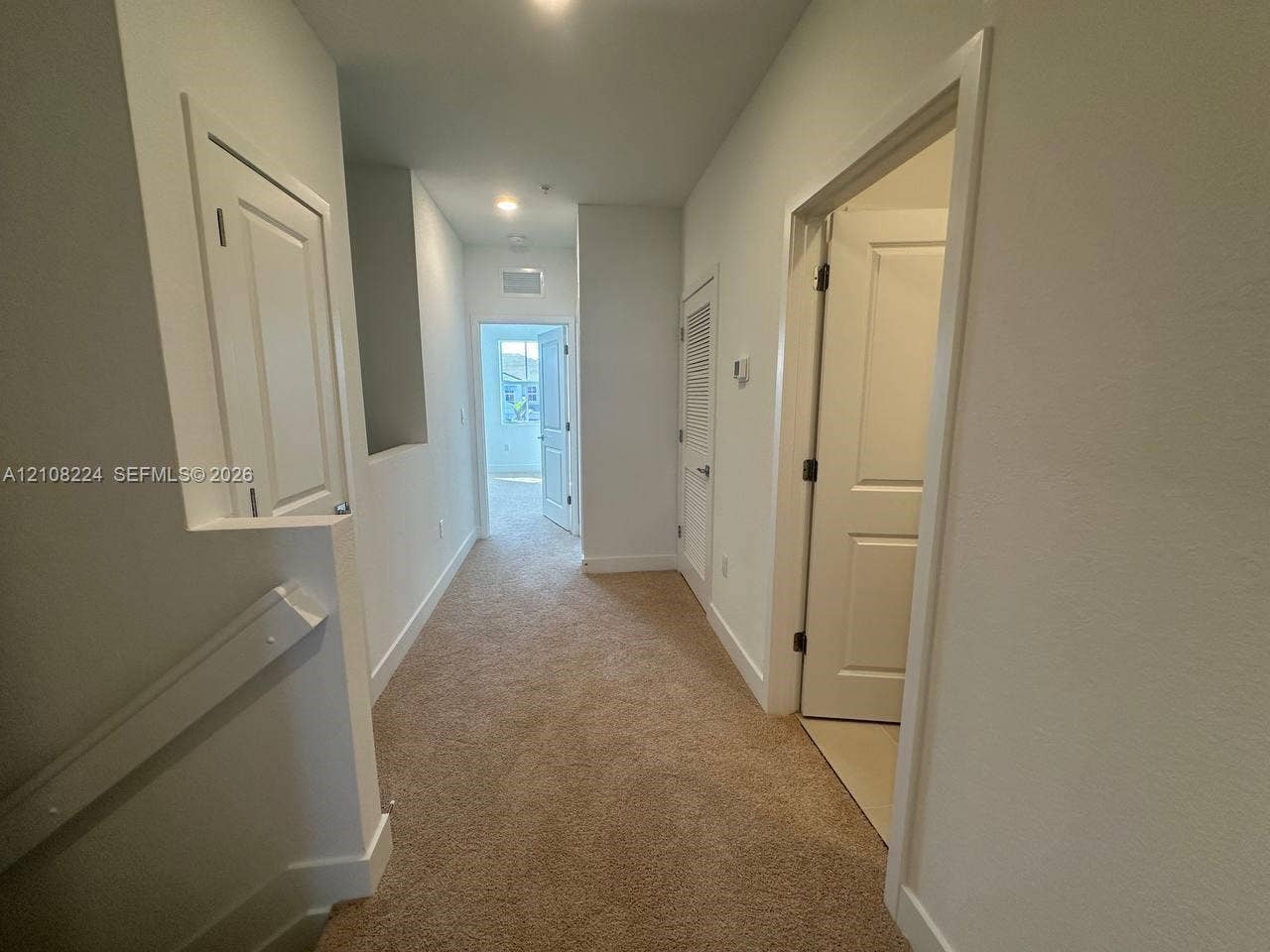 17183 SW 2nd Circle, #17183, Pembroke Pines, Pembroke Pines, FL 33027 Neutral-toned carpeting, multi-panel interior doors, and recessed ceiling lighting