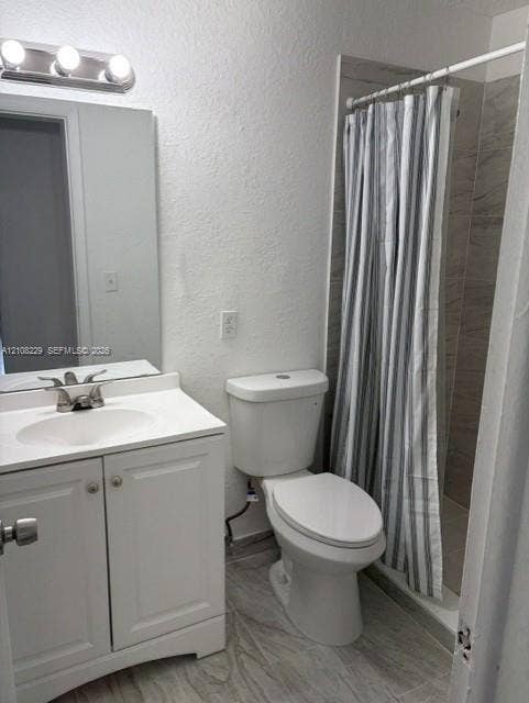 3200 Coral Springs Drive, Coral Springs, FL 33065 White vanity cabinet with an integrated basin, three-light wall-mounted fixture, polished chrome faucet, and neutral-toned tiled flooring