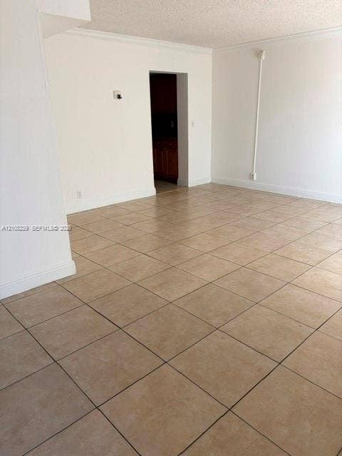 3200 Coral Springs Drive, Coral Springs, FL 33065 Neutral-toned ceramic tile flooring, clean white walls, and structured doorways