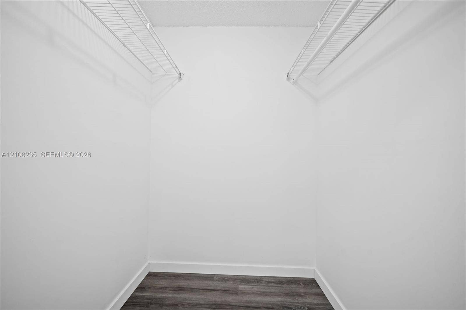 12752 SW 250th Terrace, Homestead, FL 33032 Walk-in closet featuring wood-finish flooring and dual tiers of white wire shelving