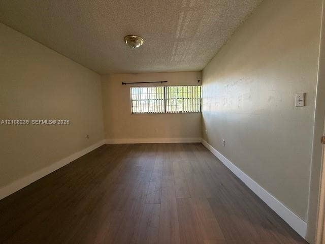 Interior room featuring wood-finish flooring, a horizontal window with vertical blinds, and a dome ceiling light fixture