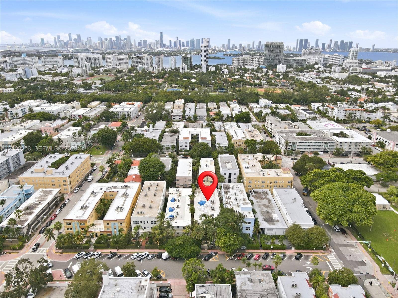 1330 Drexel Avenue, #102, Miami Beach, FL 33139 Aerial perspective showcasing an urban location with mature tree canopy and proximity to a metropolitan skyline