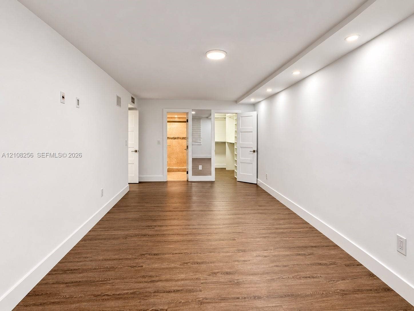 9350 Fontainebleau Boulevard, #110, Miami, Miami, FL 33172 Wood-finish flooring, recessed soffit lighting, and built-in closet shelving