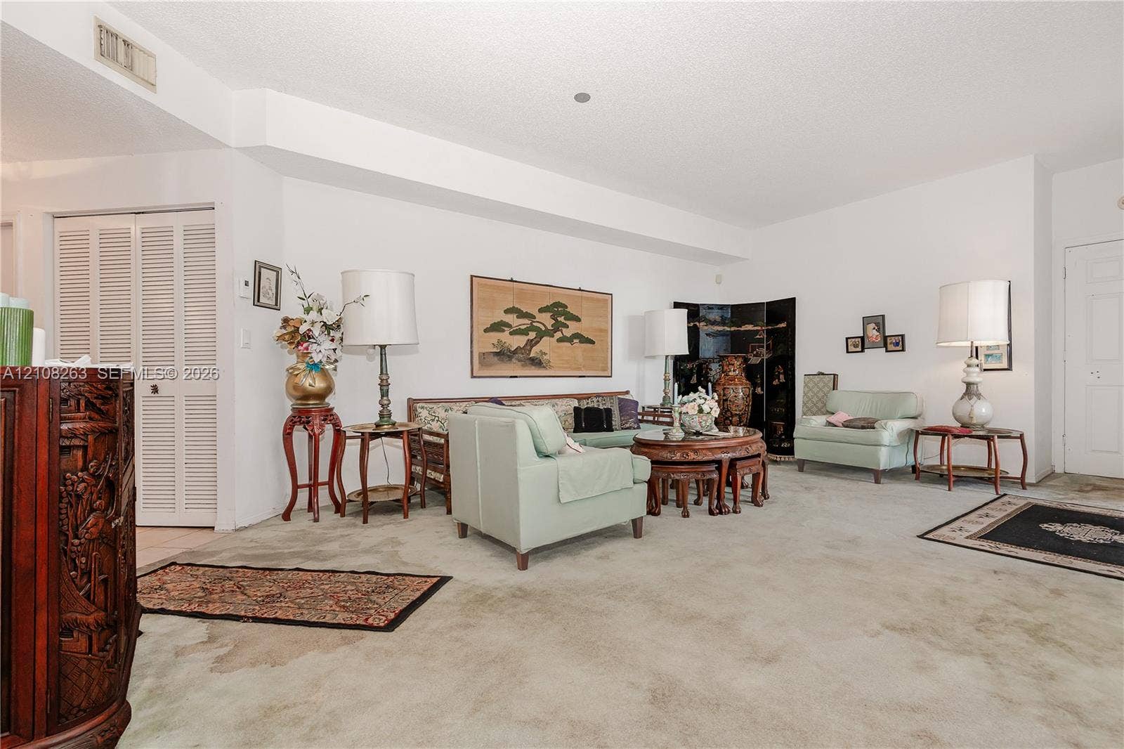 14817 Balgowan Road, #102-5, Miami Lakes, FL 33016 Spacious interior featuring neutral wall tones, clean lines, and louvered closet doors