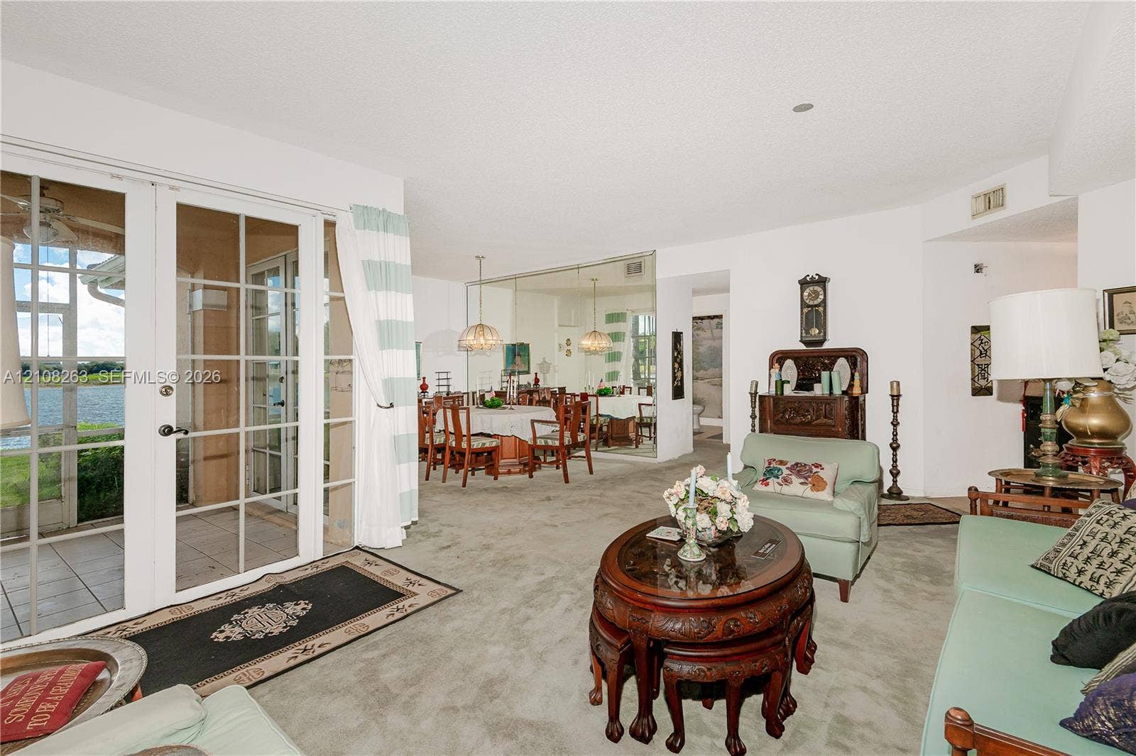 14817 Balgowan Road, #102-5, Miami Lakes, FL 33016 Full-height glass panel doors, mirrored wall, and recessed ceiling lighting